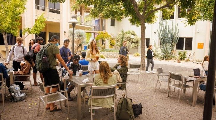 Students talk and work in Pitzer's Academic Courtyard